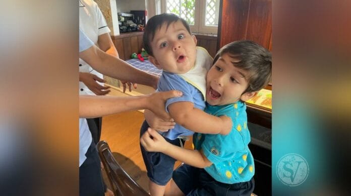 Taimur Ali Khan holding Jeh
