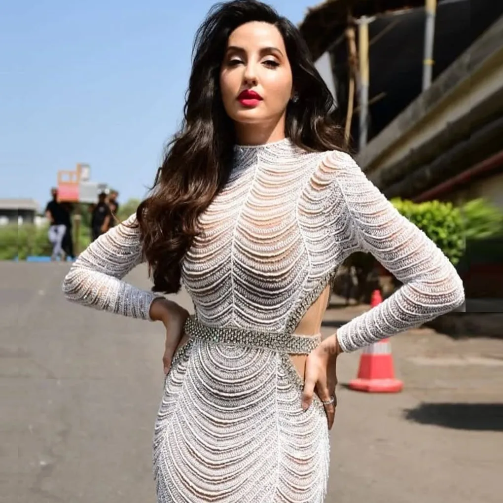 Nora Fatehi featuring in white body-hugging cut-out outfits
